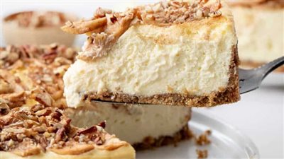 Autumn Cheesecake  Autumn Cheesecake is a rich and indulgent apple cheesecake that captures the warm and cozy flavors of the fall season. It starts with a graham cracker and pecan crust that is filled